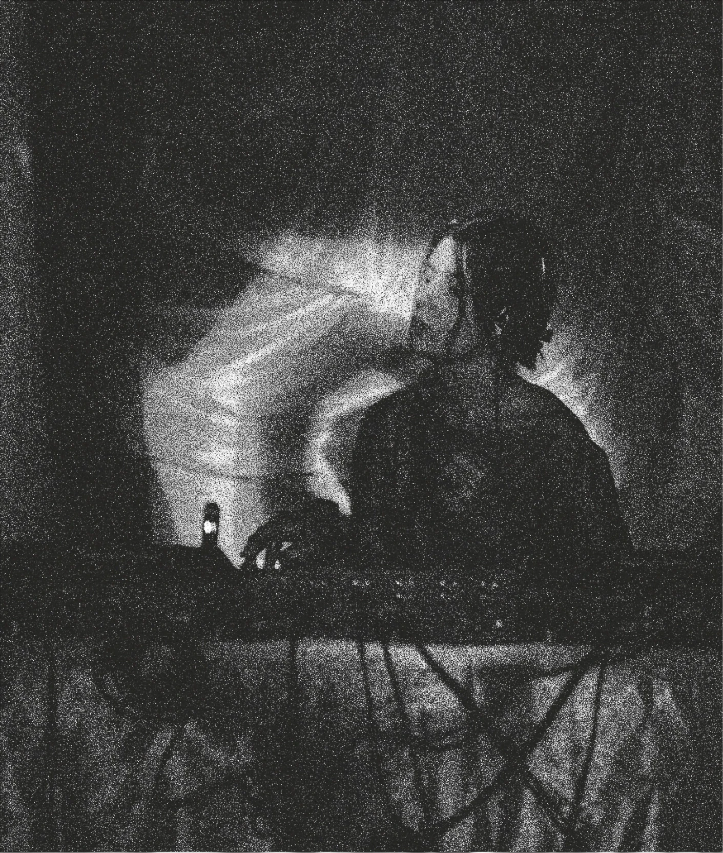 DJ performing in front of projected visuals at a Lumen event.