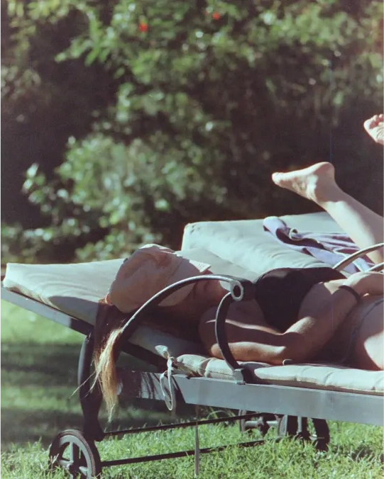 People reclining together outdoors.