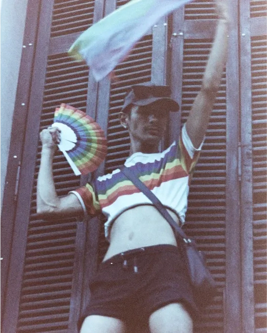 A person waving a colorful fan.