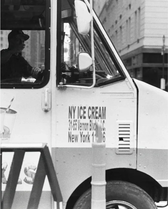 A black-and-white ice-cream truck portrait.