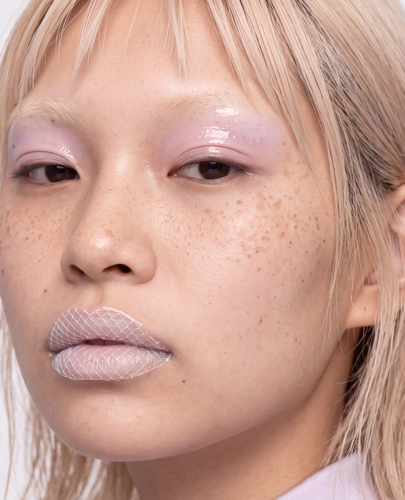 Platinum fringe, pale pink lids and soft pink lips.